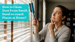 Woman holding a brush and looking thoughtful about how to clean her window blinds