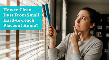 Woman holding a brush and looking thoughtful about how to clean her window blinds